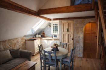 a_photograph_showcases_a_rustic_cozy_attic_apartm